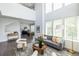 Open-concept living room with hardwood floors, high ceilings and seamlessly connected spaces at 399 Pratt Se Dr # 910, Atlanta, GA 30315