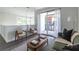 Inviting living room with a balcony, comfortable seating, and views of the surrounding area at 399 Pratt Se Dr # 910, Atlanta, GA 30315