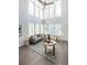 Sunlit living room features high ceilings, lots of natural light and neutral-colored furnishings at 399 Pratt Se Dr # 910, Atlanta, GA 30315