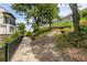 Stone path with lush landscaping leads to modern townhomes with balconies, a scenic outdoor experience at 399 Pratt Se Dr # 910, Atlanta, GA 30315