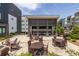 Community patio area with tables, chairs, and an outdoor kitchen area at 399 Pratt Se Dr # 910, Atlanta, GA 30315