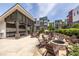 Community patio area with fire pit, tables, chairs, and an outdoor kitchen area at 399 Pratt Se Dr # 910, Atlanta, GA 30315