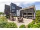 Community patio area with tables, chairs, and an outdoor kitchen area and landscaping at 399 Pratt Se Dr # 910, Atlanta, GA 30315