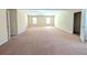 Spacious Primary bedroom with lots of light and neutral colored walls and carpet at 5622 Platte Dr, Ellenwood, GA 30294