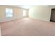 Spacious bedroom with ample natural light and neutral carpeting throughout at 5622 Platte Dr, Ellenwood, GA 30294