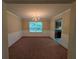 Dining room features decorative chair rail, chandelier, and view into kitchen at 5622 Platte Dr, Ellenwood, GA 30294