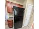 Practical kitchen with stainless steel refrigerator, ample cabinet space, and tile flooring at 5622 Platte Dr, Ellenwood, GA 30294