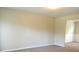Neutral living room with carpet, an adjacent view into another room, and lots of light at 5622 Platte Dr, Ellenwood, GA 30294