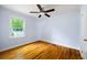 Bedroom showcasing hardwood floors, ceiling fan, and neutral paint at 1039 Ridgecrest Se Dr, Smyrna, GA 30080