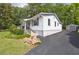 Charming single-Gathering home with manicured landscaping, driveway, and stand alone garage at 1039 Ridgecrest Se Dr, Smyrna, GA 30080