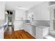 Bright kitchen features white cabinets, stainless steel sink, and hardwood flooring at 1039 Ridgecrest Se Dr, Smyrna, GA 30080