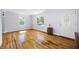 Living room with hardwood floors, white walls, and natural light from the windows at 1039 Ridgecrest Se Dr, Smyrna, GA 30080