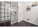 Modern bathroom with walk-in shower, black and white tiling, and stylish decor at 104 River Creek Dr, Woodstock, GA 30188