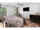 Comfortable bedroom with natural light, ceiling fan, and modern furnishings at 104 River Creek Dr, Woodstock, GA 30188