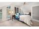 Comfortable bedroom with neutral carpet, ceiling fan, many windows for natural light and stylish furnishings at 104 River Creek Dr, Woodstock, GA 30188