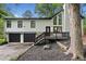 Charming split-level home with black trim, an inviting entryway, and a well-maintained yard at 104 River Creek Dr, Woodstock, GA 30188