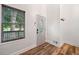 Bright entryway featuring wood floors, a front door with a decorative window, and ample natural light at 104 River Creek Dr, Woodstock, GA 30188