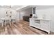 Spacious living area with adjacent dining area and sideboard, perfect for entertaining at 104 River Creek Dr, Woodstock, GA 30188