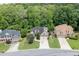 An aerial view of the charming suburban homes with manicured lawns and tree-lined streets at 1045 Legacy Walk, Woodstock, GA 30189