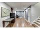 Finished basement with neutral walls, laminate floors, office space, and storage area at 1045 Legacy Walk, Woodstock, GA 30189