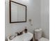 Bathroom with white walls, a sink, and a toilet at 1045 Legacy Walk, Woodstock, GA 30189