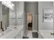 Bright bathroom featuring double sinks, modern fixtures, and stylish décor at 1045 Legacy Walk, Woodstock, GA 30189