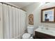Bathroom with a shower curtain, single vanity, and decorative mirror at 1045 Legacy Walk, Woodstock, GA 30189