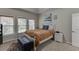 Bedroom featuring carpeted floors and multiple windows providing ample natural light at 1045 Legacy Walk, Woodstock, GA 30189
