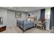 Cozy bedroom features neutral carpet, queen bed, and ample natural light at 1045 Legacy Walk, Woodstock, GA 30189