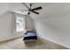 Bedroom featuring plush carpet, ceiling fan, and natural light at 1045 Legacy Walk, Woodstock, GA 30189