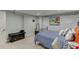 Bedroom features neutral carpet, queen bed, and ample natural light at 1045 Legacy Walk, Woodstock, GA 30189