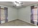 Bedroom featuring plush carpet, natural light, and modern window coverings at 1045 Legacy Walk, Woodstock, GA 30189