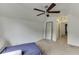 Bedroom featuring plush carpet, ceiling fan, and natural light at 1045 Legacy Walk, Woodstock, GA 30189