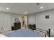 Bedroom features neutral carpet, queen bed, and ample closet space at 1045 Legacy Walk, Woodstock, GA 30189