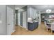 View of an open kitchen featuring two-tone cabinets, stainless appliances, and hardwood floors at 1045 Legacy Walk, Woodstock, GA 30189
