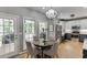 Eat-in kitchen with stainless steel appliances, a table, and a view to the exterior at 1045 Legacy Walk, Woodstock, GA 30189