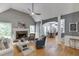 Comfortable living room features hardwood floors, fireplace, and a vaulted ceiling at 1045 Legacy Walk, Woodstock, GA 30189