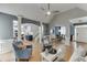 Open floor plan from living room to kitchen and dining areas with hardwood floors at 1045 Legacy Walk, Woodstock, GA 30189