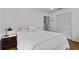 Cozy bedroom with neutral tones, comfortable bedding, and a side table with elegant lamp at 515 Houze Way, Roswell, GA 30076
