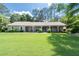 Charming single story home with a large yard and covered porch at 515 Houze Way, Roswell, GA 30076
