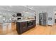 Stylish kitchen with a center island, stainless steel appliances and open floor plan at 515 Houze Way, Roswell, GA 30076
