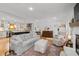 Spacious living room with fireplace open to the kitchen and dining area at 515 Houze Way, Roswell, GA 30076