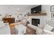 Cozy living room features a fireplace, comfortable seating, and elegant decor at 515 Houze Way, Roswell, GA 30076