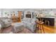 Open floorplan showing living, dining, and kitchen with hardwood floors and natural light at 515 Houze Way, Roswell, GA 30076