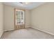 Bedroom features a window with vertical blinds allowing natural light into the room at 6359 Wedgeview Dr, Tucker, GA 30084