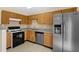 Modern kitchen with sleek appliances, granite countertops, and ample storage space at 6359 Wedgeview Dr, Tucker, GA 30084