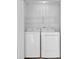 Small laundry area with full-size washer and dryer at 6359 Wedgeview Dr, Tucker, GA 30084