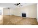 Expansive living room with a charming fireplace, creating a cozy ambiance for relaxing and entertaining guests at 6359 Wedgeview Dr, Tucker, GA 30084