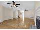 Inviting living room with hardwood floors, a fireplace, and ceiling fans, creating a relaxing atmosphere at 6359 Wedgeview Dr, Tucker, GA 30084