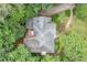 An overhead view of a lush landscape featuring a home with an attached deck and surrounding greenery at 1763 Benningfield Sw Dr, Marietta, GA 30064